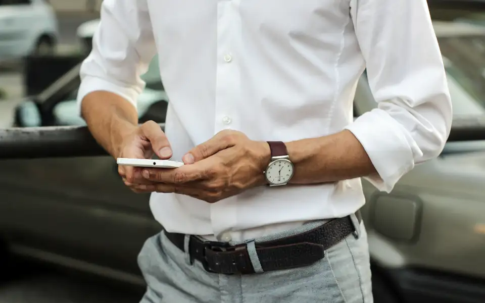 Man checking a GCash payment on his phone before depositing on 218PLUSPH